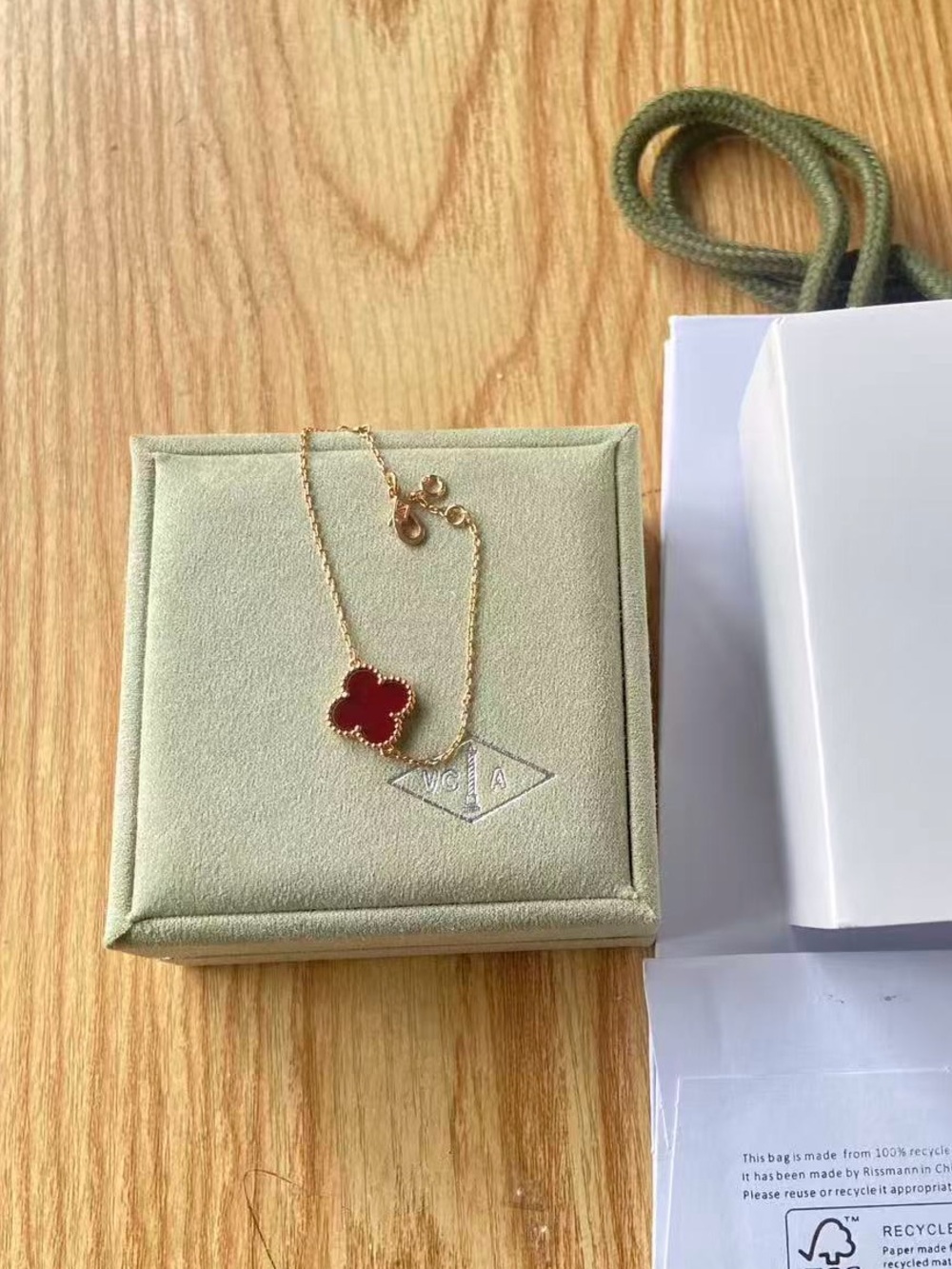 Van Cleef & Arpels Gold Bracelet with Red Clover Motif